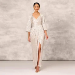 Pleated Foiled Long Column Dress With Slit And Flutter Sleeves In Silver Gold
